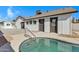 Relaxing kidney-shaped pool with a concrete deck and a pool ladder at 1104 N Oak Ct, Gilbert, AZ 85233