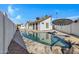 Inviting kidney-shaped pool with flagstone and a covered patio area at 1104 N Oak Ct, Gilbert, AZ 85233