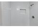 Clean shower with white tile and built-in shelf at 1104 N Oak Ct, Gilbert, AZ 85233