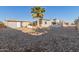 Spacious backyard with gravel and a storage shed at 1126 S 97Th Way, Mesa, AZ 85208