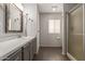 Updated bathroom with gray vanity, walk-in shower, and tile flooring at 1126 S 97Th Way, Mesa, AZ 85208