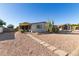 Front yard view of manufactured home with walkway and cacti at 1126 S 97Th Way, Mesa, AZ 85208