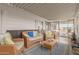 Relaxing screened porch with wicker furniture and comfortable seating at 1126 S 97Th Way, Mesa, AZ 85208