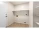 Laundry room with built-in shelving and tile flooring at 11670 W Pine Mountain Ct, Surprise, AZ 85378