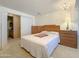 Bright bedroom with a double bed and built-in dresser at 120 N Val Vista Dr # 81, Mesa, AZ 85213