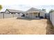 Backyard view of house with covered patio at 12750 W Dreyfus Dr, El Mirage, AZ 85335