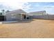 Backyard view of house with covered patio at 12750 W Dreyfus Dr, El Mirage, AZ 85335