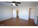 Bedroom with hardwood floors and double door closet at 12750 W Dreyfus Dr, El Mirage, AZ 85335