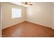 Bright bedroom with wood flooring and window blinds at 12750 W Dreyfus Dr, El Mirage, AZ 85335