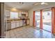 Kitchen with stainless steel appliances and backyard access at 12750 W Dreyfus Dr, El Mirage, AZ 85335