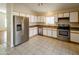 Kitchen features stainless steel appliances and light cabinets at 12750 W Dreyfus Dr, El Mirage, AZ 85335