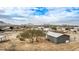 Aerial view of a manufactured home with a large yard and desert landscape at 13705 S 209Th Ave, Buckeye, AZ 85326