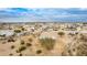 Aerial showing a home and surrounding desert landscape and other houses at 13705 S 209Th Ave, Buckeye, AZ 85326