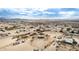 Aerial view of a home on a large lot with desert landscape and distant mountains at 13705 S 209Th Ave, Buckeye, AZ 85326