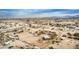 Aerial view showing a house on acreage with a desert landscape and distant mountains at 13705 S 209Th Ave, Buckeye, AZ 85326