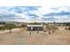 Aerial view of the home and surrounding desert landscape at 13705 S 209Th Ave, Buckeye, AZ 85326