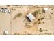 An aerial view of a single-story house on a large lot in a desert setting at 13705 S 209Th Ave, Buckeye, AZ 85326