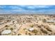 Aerial view of property showcasing a desert landscape with multiple houses and RV's at 13705 S 209Th Ave, Buckeye, AZ 85326