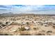 Aerial view of a home in a desert landscape with distant mountains at 13705 S 209Th Ave, Buckeye, AZ 85326