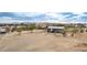 Aerial view showing a house on a spacious lot with surrounding desert landscape at 13705 S 209Th Ave, Buckeye, AZ 85326