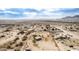 Aerial view of a home in a desert community with distant mountains at 13705 S 209Th Ave, Buckeye, AZ 85326