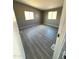 Spacious bedroom with gray walls and wood-look floors at 13705 S 209Th Ave, Buckeye, AZ 85326