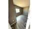 Bedroom with gray walls and wood-look floors at 13705 S 209Th Ave, Buckeye, AZ 85326