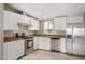 Modern kitchen with stainless steel appliances and white cabinets at 13705 S 209Th Ave, Buckeye, AZ 85326