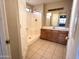 Clean bathroom with shower/tub combo and wood vanity at 13943 S Amado Blvd, Arizona City, AZ 85123