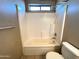 Bathroom with tub/shower combo and toilet at 13943 S Amado Blvd, Arizona City, AZ 85123