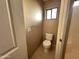 Small bathroom with toilet and tile flooring at 13943 S Amado Blvd, Arizona City, AZ 85123