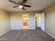 Spacious bedroom with carpeted floor and ceiling fan at 13943 S Amado Blvd, Arizona City, AZ 85123