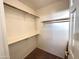 Walk-in closet with shelves and hanging rod at 13943 S Amado Blvd, Arizona City, AZ 85123