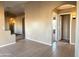 Hallway with tile floors and a view into a bedroom at 13943 S Amado Blvd, Arizona City, AZ 85123