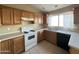 View of the kitchen sink and stovetop at 13943 S Amado Blvd, Arizona City, AZ 85123