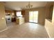 Kitchen with wooden cabinets, tile floor, and a breakfast bar at 13943 S Amado Blvd, Arizona City, AZ 85123