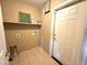 Functional laundry room with washer/dryer hookups and extra shelving at 13943 S Amado Blvd, Arizona City, AZ 85123