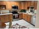 Kitchen boasts wood cabinets and stainless steel appliances at 14300 W Bell Rd # 5, Surprise, AZ 85374