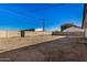 Large backyard with dirt and block wall at 1510 E Ironwood Dr, Buckeye, AZ 85326