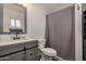 Bathroom with gray vanity and shower at 1510 E Ironwood Dr, Buckeye, AZ 85326