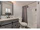 Clean bathroom with gray vanity, shower/tub combo, and updated fixtures at 1510 E Ironwood Dr, Buckeye, AZ 85326