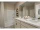 Elegant bathroom with double vanity and a shower/tub combo at 17066 W Seldon Ln, Waddell, AZ 85355