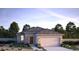 Single-story home with a gray exterior, tile roof, and landscaped yard at 17066 W Seldon Ln, Waddell, AZ 85355