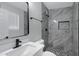 Modern bathroom with gray marble-style shower and hexagon floor tile at 2046 E Alder Cir, Mesa, AZ 85204