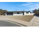 House exterior with gray garage door and landscaping at 2046 E Alder Cir, Mesa, AZ 85204