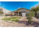 Backyard view showing patio, shed and grassy area at 2135 N St Pedro Ave, Casa Grande, AZ 85122