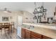 Kitchen with wooden cabinets, stainless steel appliances, and a pot rack at 2135 N St Pedro Ave, Casa Grande, AZ 85122