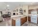 Kitchen features wooden cabinets, a double sink, and a dishwasher at 2135 N St Pedro Ave, Casa Grande, AZ 85122