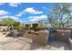 Outdoor kitchen with a built-in grill and seating area at 2223 W Hazelhurst Ct, Anthem, AZ 85086