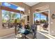 Charming breakfast nook with glass-top table and access to patio at 2223 W Hazelhurst Ct, Anthem, AZ 85086